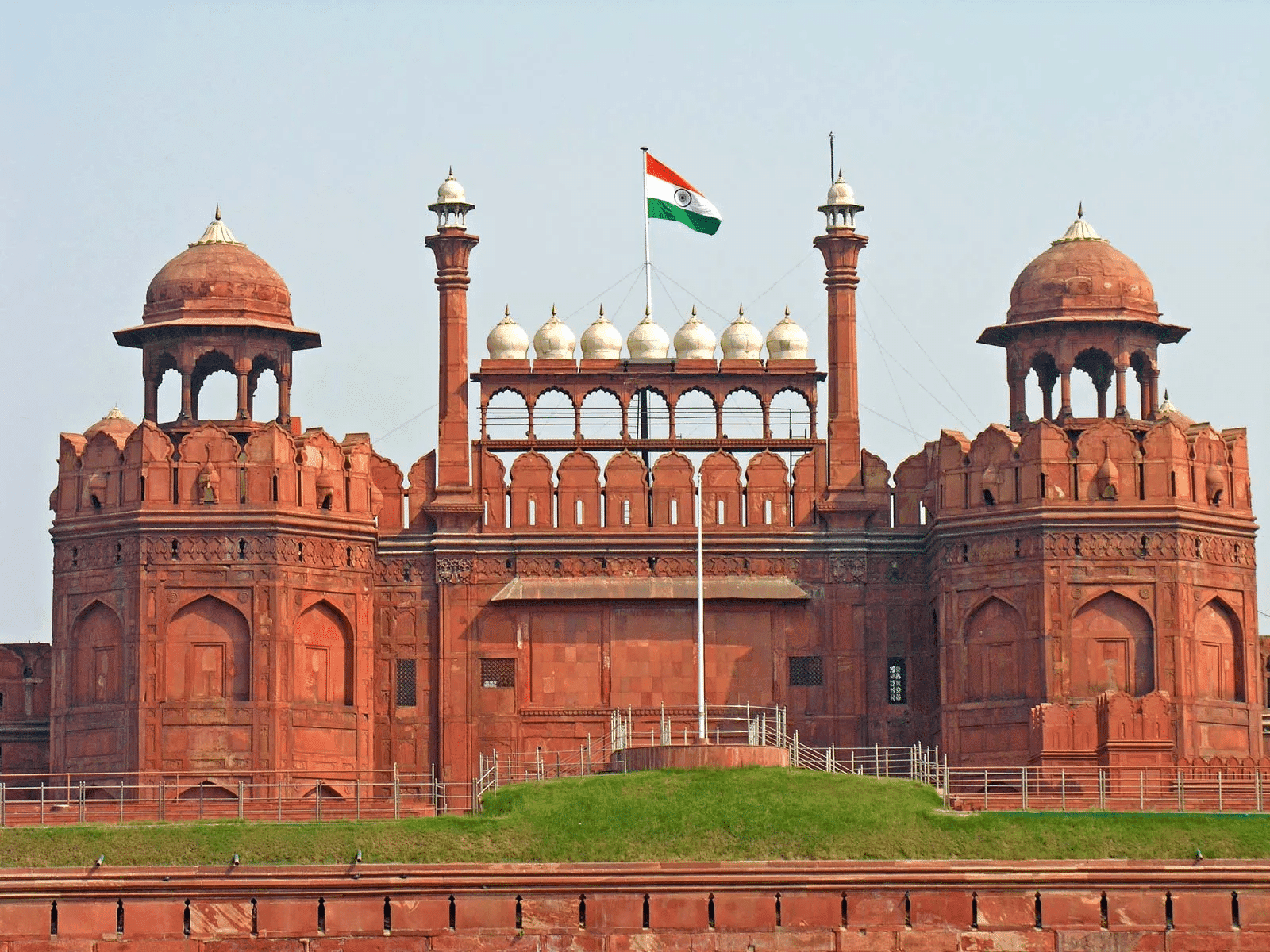 Golf course in India with traditional architecture and scenic views